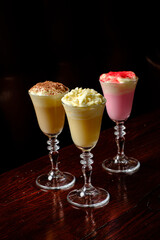 Three delicious dessert drinks showcase creamy textures and vibrant colors, inviting indulgence