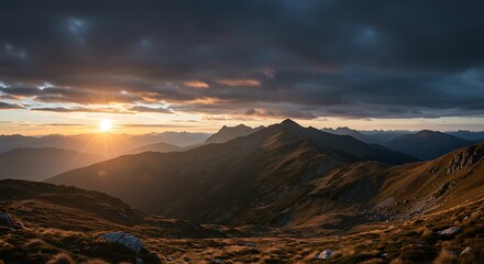 Obraz premium Mountain Range at Sunset with Dramatic Sky and Golden Light