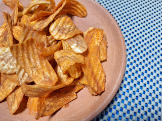 Dried fried bananas in a clay dish