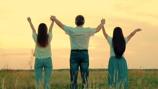 Group of people holding hands raise their hands to sky, prayer of man of woman. Business people, partners, trust concept. Teamwork of people raising their hands to sky, family business team concept.