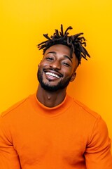 Fototapeta premium A man with dreadlocks smiles at the camera