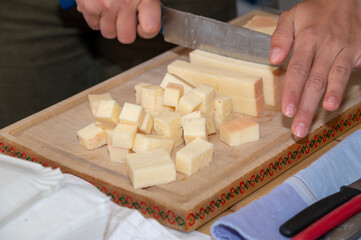 block of cheese gets cut in dices