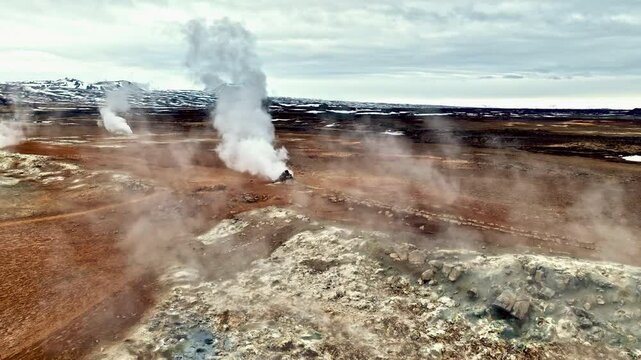 Aerial view over smoking fumaroles in the Hverir geothermal area, in Iceland