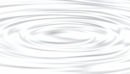 Blue abstract ripples expand in a circle on the clear water surface from a single drop