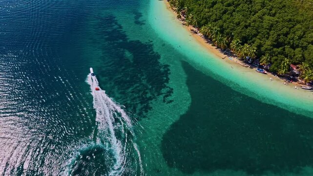 Water Taxi Across The Pristine Beaches In Bocas Del Toro, Panama, Central America. Aerial Drone Shot