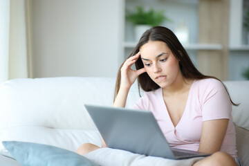 Frustrated woman complaining checking laptop after mistake