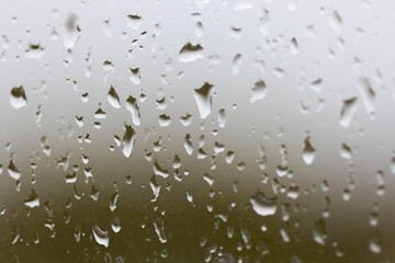Close-Up of Droplets on Glass Against a Blurry Background