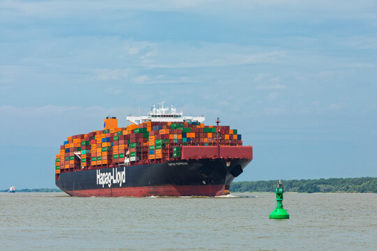 Stade, Germany &ndash; June 14, 2019: Container ship SANTOS EXPRESS, operated by Hapag-Lloyd, on Elbe river heading towards Hamburg.