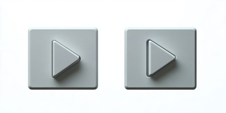 Two gray rectangular buttons with embossed right-pointing play symbols on a white background, casting soft shadows creating a minimalistic and modern digital design feel