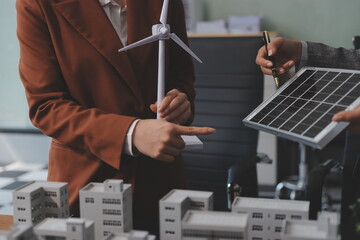 Discussion among businesspeople on the latest developments in solar cell panel technology and Solar...