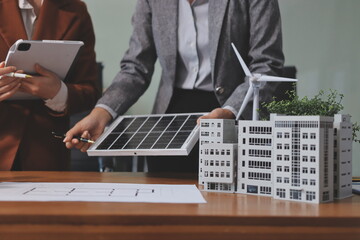 Discussion among businesspeople on the latest developments in solar cell panel technology and Solar...