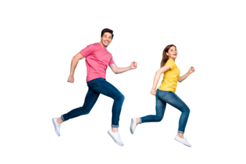 Full length body size profile side view of nice attractive funny cheerful cheery couple running fast speed in air having fun isolated over bright vivid shine vibrant green turquoise background
