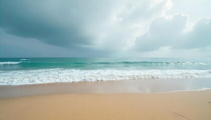 Fototapeta premium Lonely shore, grey sky, waves crash on deserted sand, peace, atmospheric