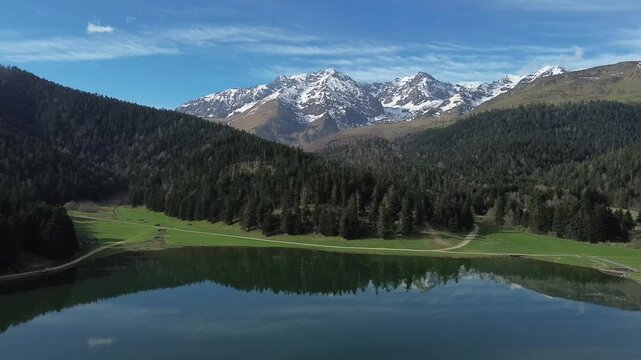 Aerial view of Lac de Payolle in the pyrenees, also known as little canada from the locals. It is located in the communes of Campan and Arreau of the Hautes-Pyr&eacute;n&eacute;es department. Dolly Move backward.