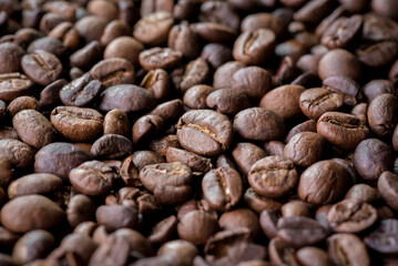 Close up of coffee beans are the background.
