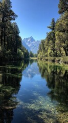 Obraz premium A still lake mirrors towering mountains surrounded by lush trees, creating a peaceful atmosphere. The serene waters invite reflection and exploration in this natural setting