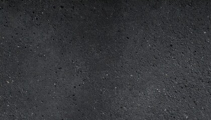 Fototapeta premium Close-up of slate gray concrete surface with fine aggregate texture, captured in low angle natural lighting