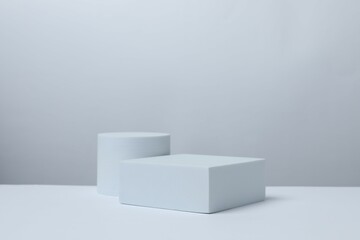 White podiums on a light background. Clean empty wall scene. Platforms vector geometric design