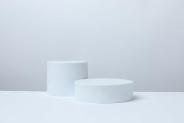 White podiums on a light background. Clean empty wall scene. Platforms vector geometric design