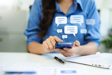 Woman hands  User typing on smartphone and tablet chatting conversation in chat box icon pop up for social media marketing technology concept.