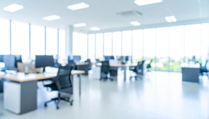 A softly blurred office interior with neutral tones and open-plan desks creates a clean, modern corporate atmosphere. Natural light streams through large windows, casting subtle highlights across the 