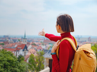 Tourist woman explores beautiful city of Erfurt, wandering through its historic streets, admiring...