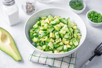 Avocado cucumber salad in a bowl