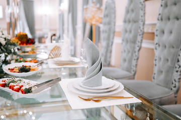 Elegant dining table setup for a special occasion in a luxurious venue with decorative elements