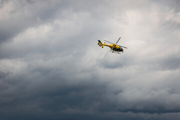 Flying yellow helicopter of emergency medical service. Themes rescue, help and hope..