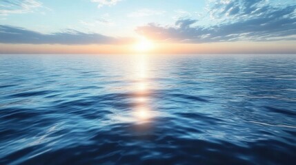 Calm ocean with gentle waves reflecting golden sunrise under partly cloudy sky creating peaceful and serene atmosphere