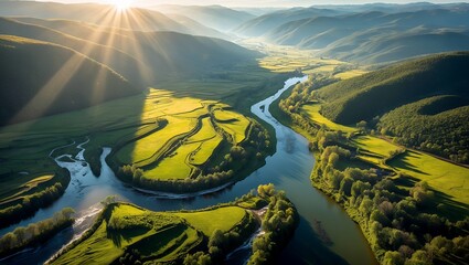 Aerial view of a serene valley with sun rays