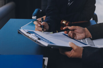 Judge gavel with Justice lawyers, Business woam in suit or lawyer working on a documents. Legal law, advice and justice concept..