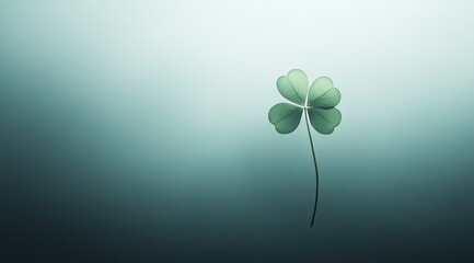 A single clover leaf, softly lit