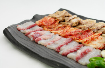 Close-up of Korean Samhap with Raw Fish, Kimchi, and Pork