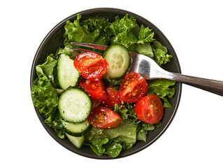 Fresh cucumber and tomato salad with green lettuce on plate with fork