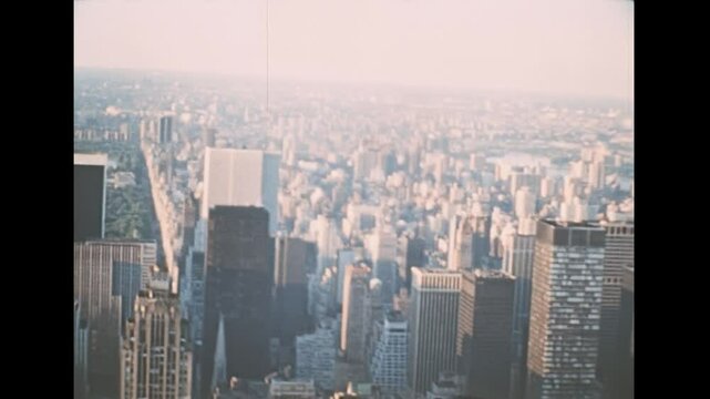 New York, United States America - 1976: Archival of Manhattan skyline with Rockefeller Center skyscraper and Pan Am Tower Airways in 1970s, now become the MetLife Building HQ insurance company.