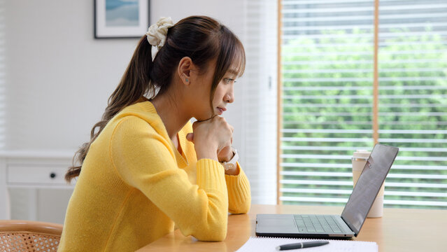 Asia people young woman study hard brownout bored remote work fix coding bug online read data tired sitting at home desk think worry in career job tough stress workforce mental health issue illness.