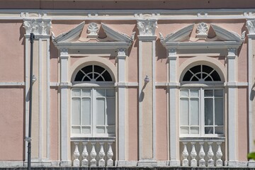 Fototapeta na wymiar Classical Building Facade with Ornate Windows