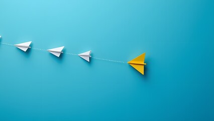 Unique Leadership Concept Yellow Paper Airplane Leading White Ones