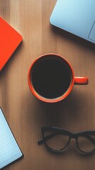 Overhead Flat Lay of Coffee Cup Laptop Notebook and Glasses on Wood Desk for Remote Work or Study