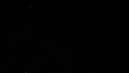 Starry night sky with faint scattered lights in darkness