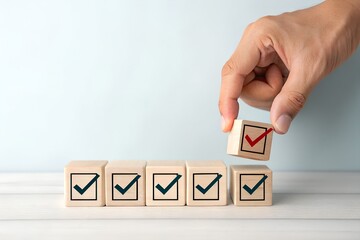 Checklist and task progress tracking concept. A hand placing the final checkmark on wooden blocks in a progress bar, task completion, productivity, goal setting, and efficient project management.