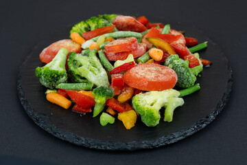 Frozen vegetable mix. Chopped mixture of carrots, corn, peas, legume, broccoli and pepper
