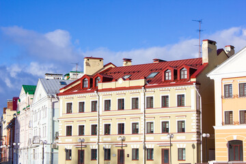 The old vintage architecture of the houses. Apartments in the old neighborhood, street.