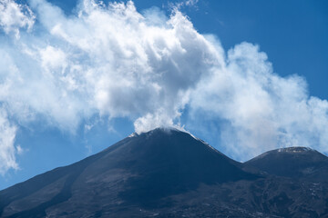 Volcanic summit with smoke cloud on Mount Etna