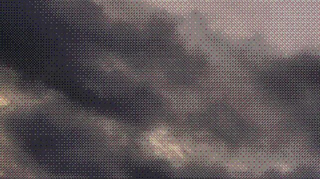Video of dark storm clouds with a digital dithering effect. Stylized pixel texture in color. Moody and cinematic look for backgrounds, motion design, or visual effects.