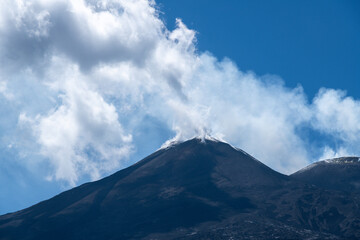 Mount Etna summit emitting volcanic gases and smoke
