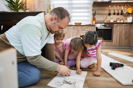 Family bonding time during DIY project in a cozy kitchen