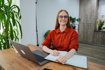 Creative professional working in a stylish home office during the day