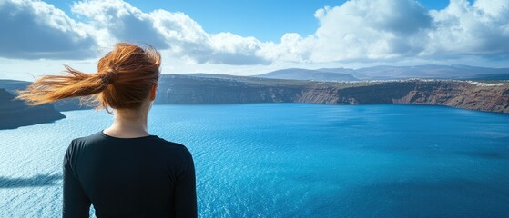 Woman contemplating a caldera lake vista.